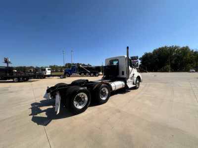 Kenworth T880 in 2-axle tractor configuration shown from rear-left side with white cab, chassis, and black wheels.