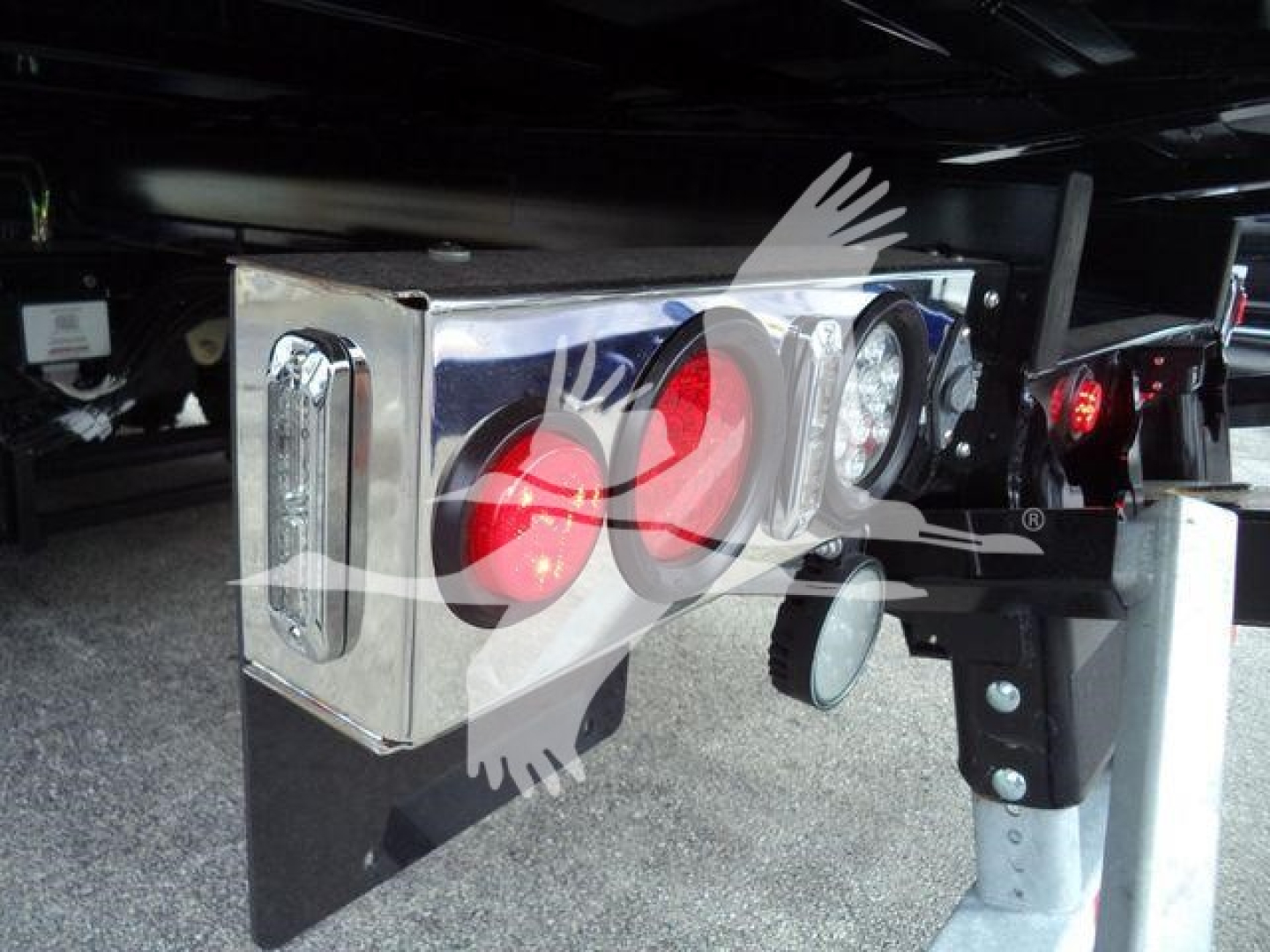 Kenworth T280 truck rear end showing chrome toolbox, taillights, and bumper undercarriage view.