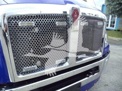 Kenworth T680 style front grill with chrome mesh, KW emblem and two side badge plates visible.