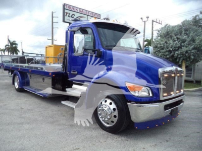 Kenworth T280 rollback truck in blue, side view showing flatbed with chrome wheels and front grille.