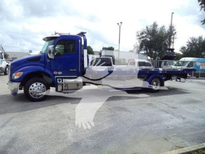 Blue 2025 Kenworth T280 rollback truck shown in side profile with extended chassis and towing bed.