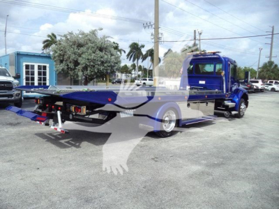New Kenworth T280 rollback truck with purple cab and flatbed, showing the rear ramp and mirrors.