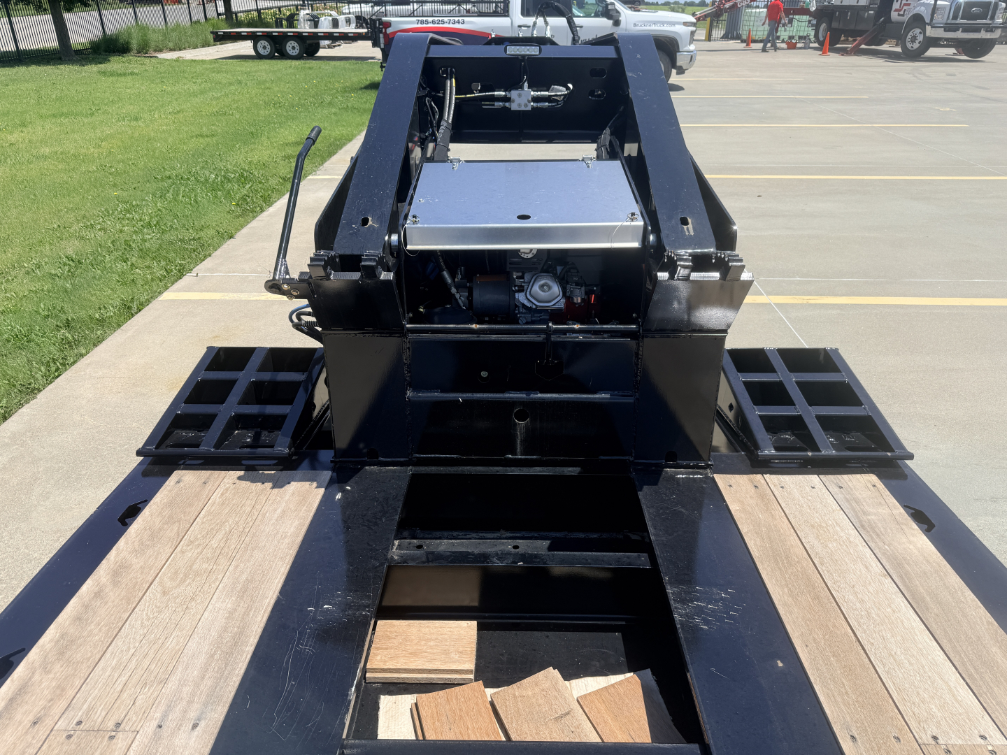 Alpha A110HDG-SF-18" LDH lowboy trailer showing hydraulic system and deck planks.