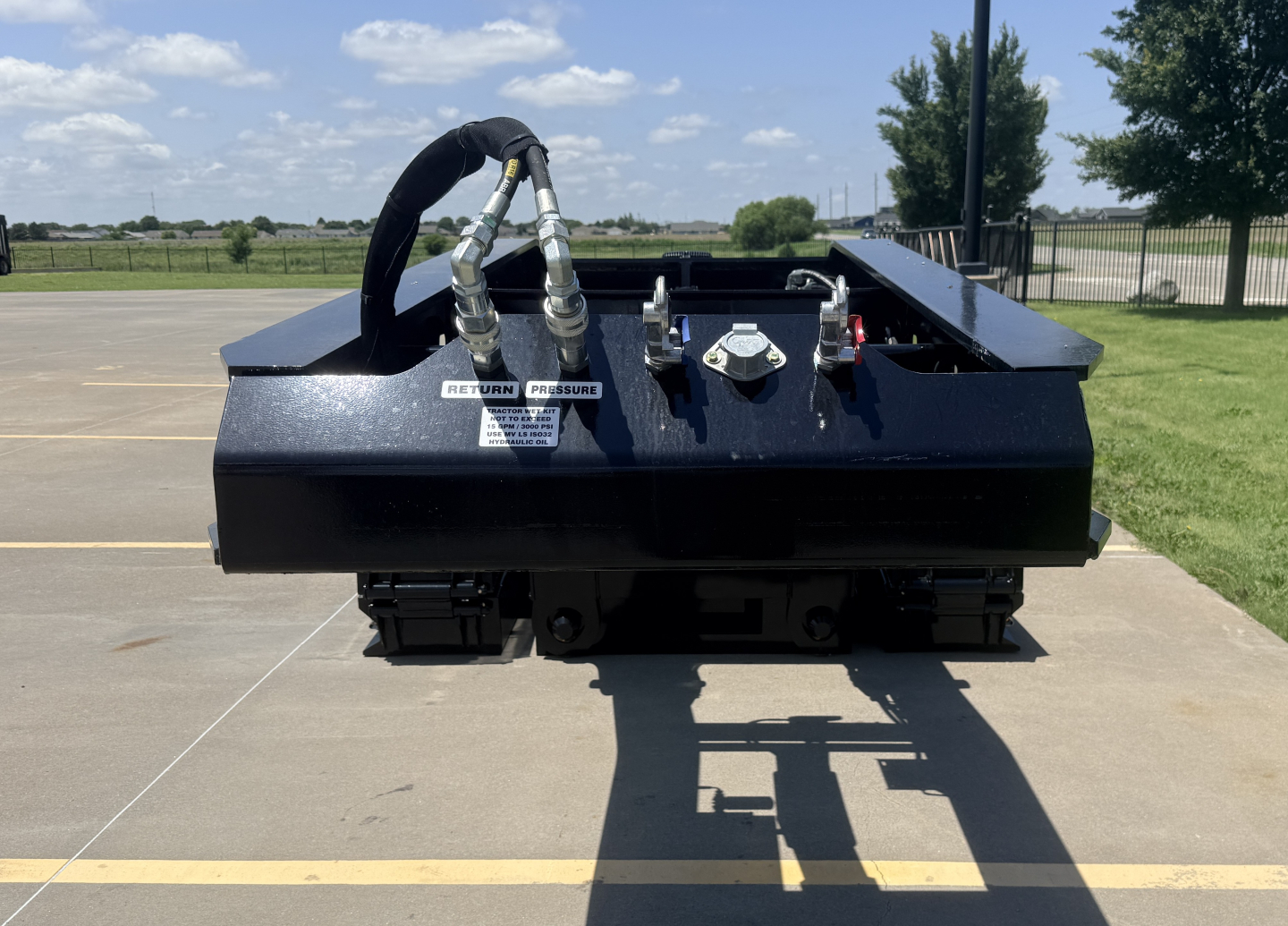 Alpha A110HDG-SF-18" LDH lowboy trailer front view showing hoses, connectors, and deck frame; text labels on control panel and safety decals visible.