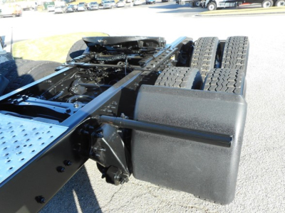 Freightliner Cascadia tractor chassis and dual rear axles showing hitch area and frame.