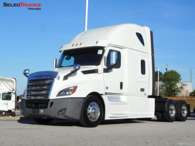 Freightliner Cascadia 126 semi-truck in white, angled view, sleeper cab, with chrome grille and dual rear axles.