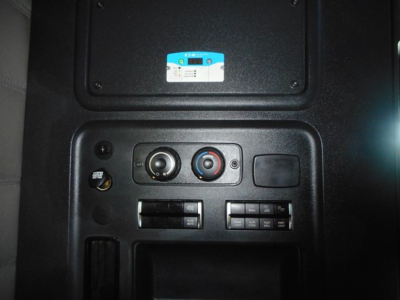 Dashboard controls in Freightliner Cascadia with climate and radio controls visible