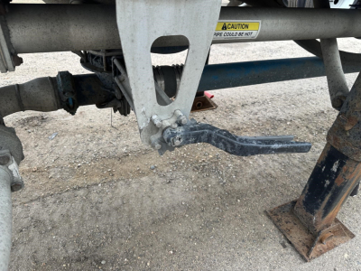 Mac 1050 cu ft pneumatic trailer hitch and suspension components with air ride rear disassembly area.