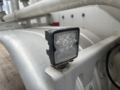 Trailer lighting LED work light mounted on aluminum frame of pneumatic dry bulk trailer.