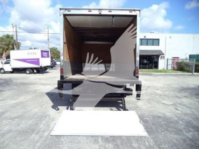 Isuzu NPRR box truck rear view with hydraulic liftgate deployed and empty cargo area.
