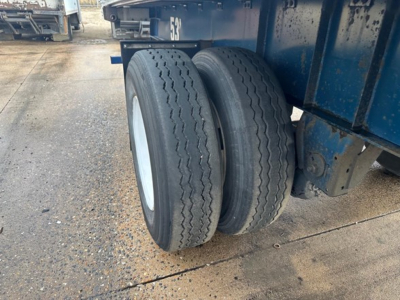 Great Dane Freedom LT trailer rear dual tires and blue chassis showing treaded tires and suspension components.