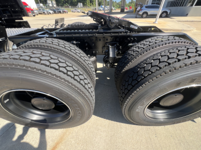 Volvo VNL64T840 tractor rear view showing dual rear axles with large prime-mover tires and wheel hubs.