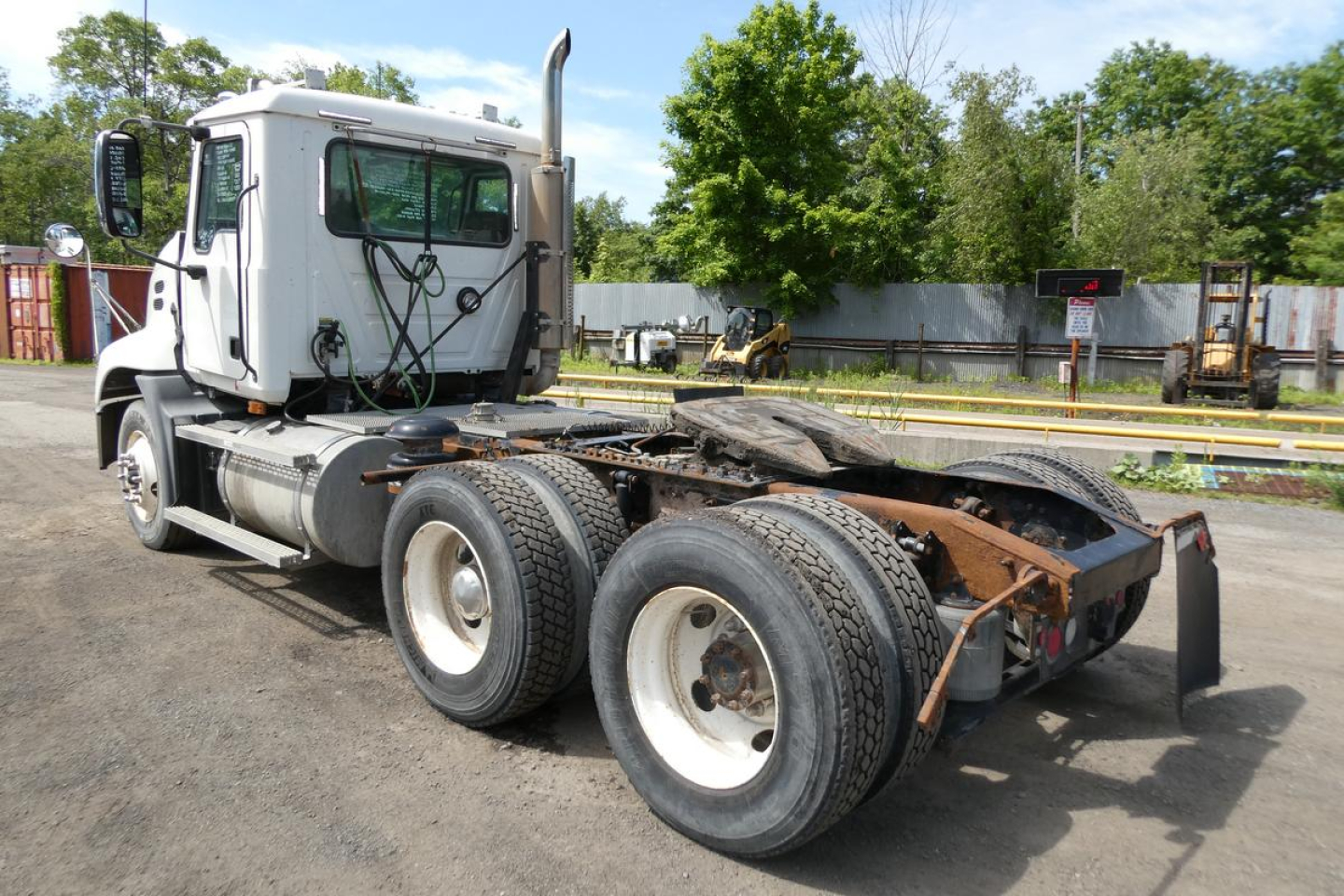 Truck chassis view showing rear axles and fifth wheel on a 2007 Mack CXN613 daycab