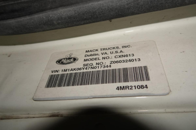 Mack Trucks label on cab showing Mack Trucks, Inc., Dublin VA USA, Model CXN613, VIN 1M1AK06Y47N017344, Seq. No. 260324013, barcode, 4MR21084.