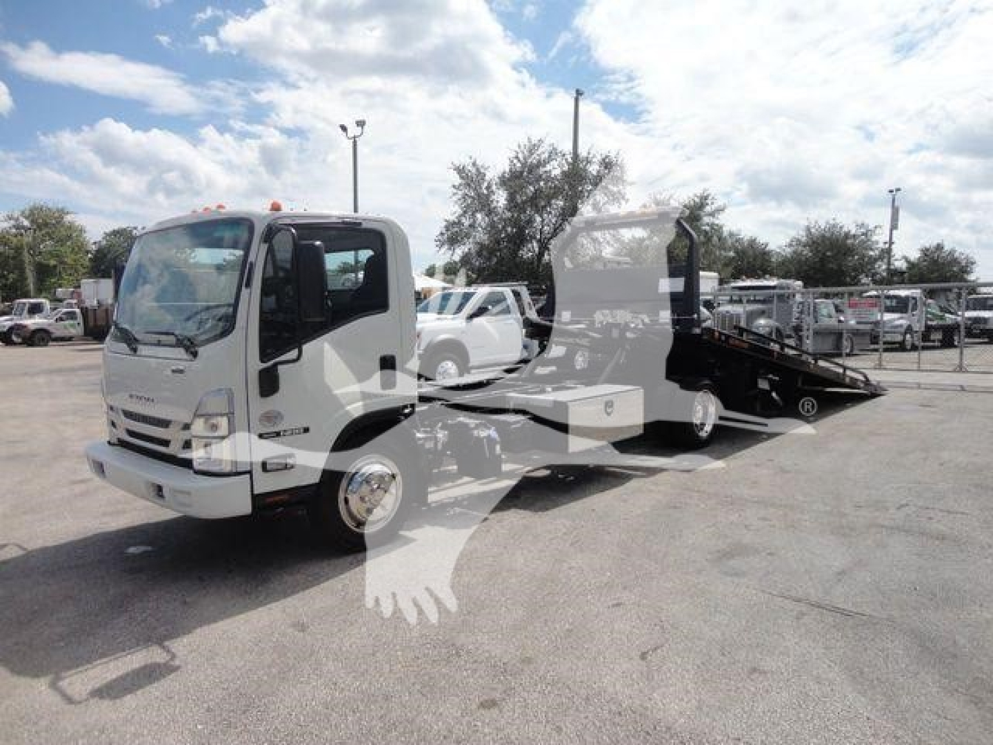 Isuzu NPR/NRR tow truck with flatbed, front cab visible, no visible text on cab or decals in image