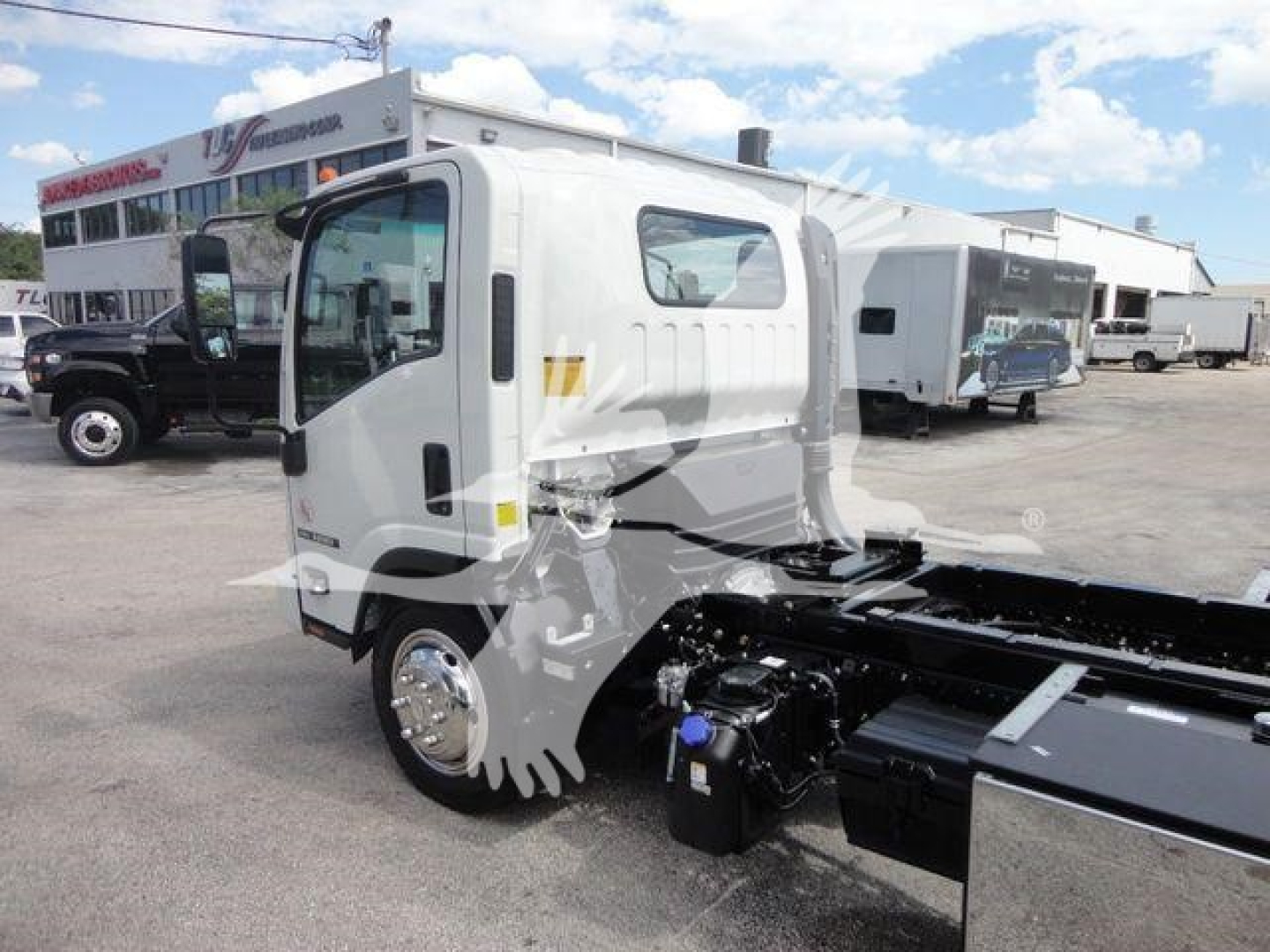 Isuzu NPR/NRR cab chassis showing front-left view and chassis rails with engine bay area visible