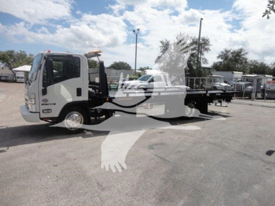 Isuzu NPR truck with rollback tow body, side view showing flatbed and cab, stock number NRRDSL22XLP.