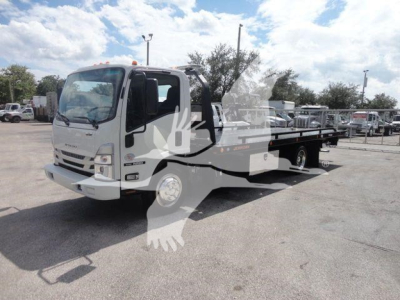 Isuzu NPR/NRR tow truck with flatbed; side view of cab and extended flatbed.