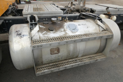 Peterbilt 567 fuel tank and side view showing aluminum cylindrical tank with steps and markings 'No Fuel' and 'No Hyd Oil' on top surface.