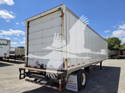 Trailer side and rear view of a white 2014 Wabash van trailer showing rear doors and reflective red/white tape.