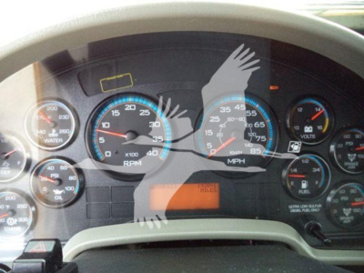 Dashboard gauges of a 2019 International Durastar 4300 showing RPM, speed, fuel, and other indicators. Center display shows orange warning/status area.