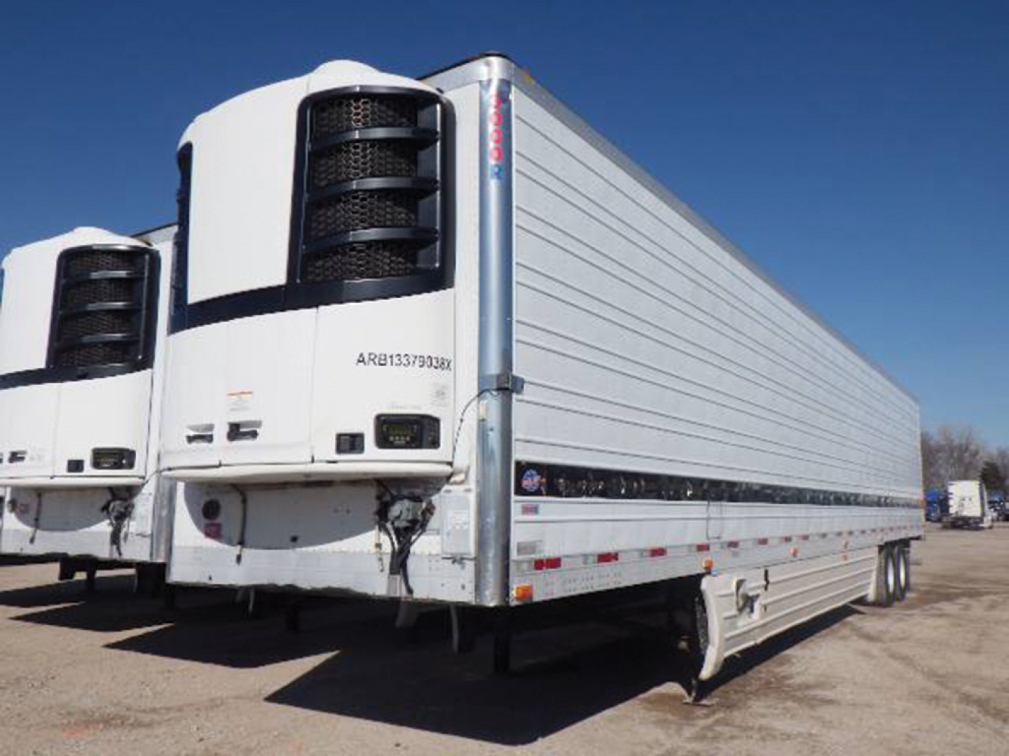 Utility 3000R refrigerated trailer showing side profile and front refrigeration unit with ARB serial on door
