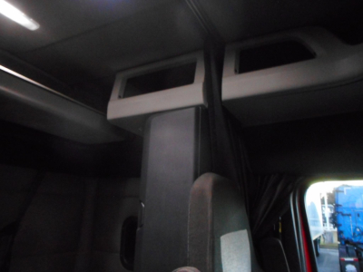 Cab interior of a 2020 Freightliner Cascadia 116 showing overhead sleeper bunk area and windows.