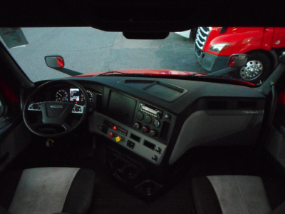2020 Freightliner Cascadia 116 interior dash view showing steering wheel, dashboard, and center console. VIN/stock label details not visible in image.