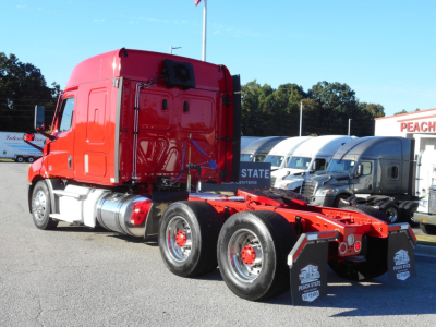 Freightliner Cascadia 116 tractor rear view showing chassis and wheels with cab in red color.