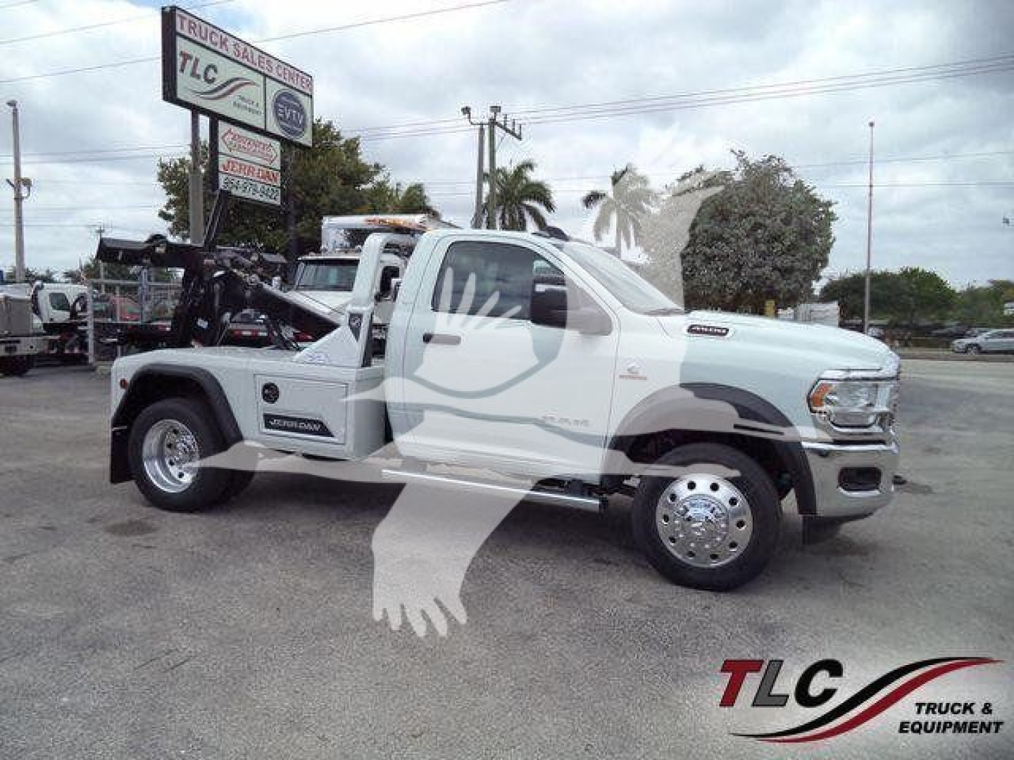 Ram 4500 SLT tow truck chassis with front cab, winch installed, white color, side profile view.