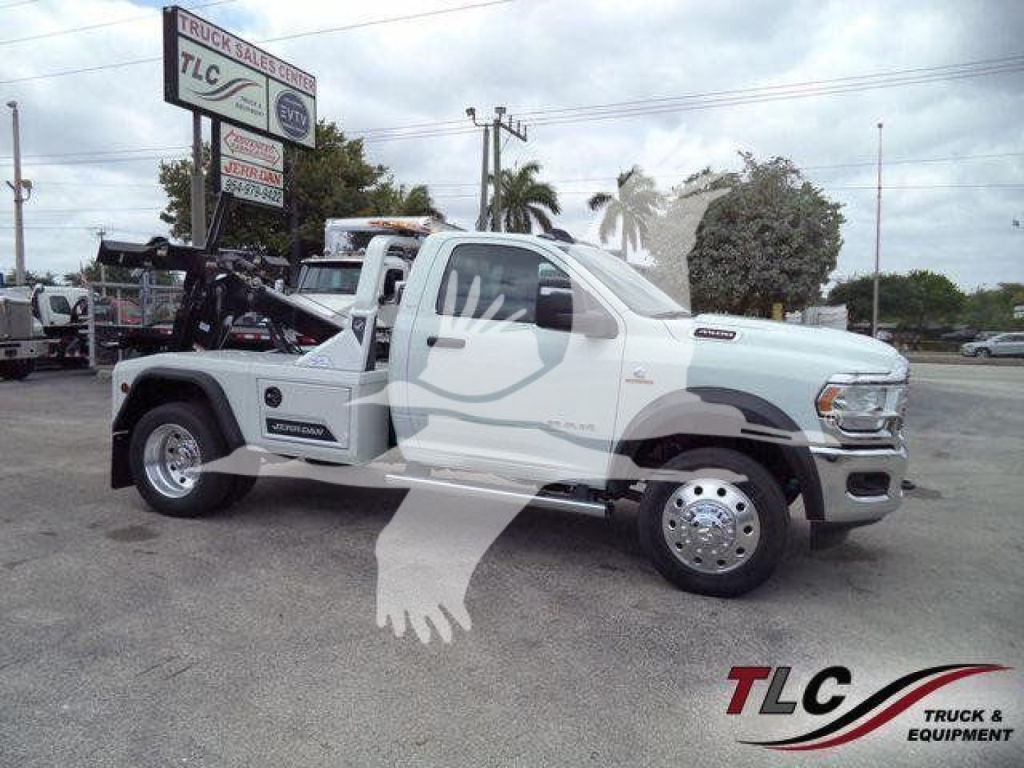 Ram 4500 SLT tow truck chassis with front cab, winch installed, white color, side profile view.
