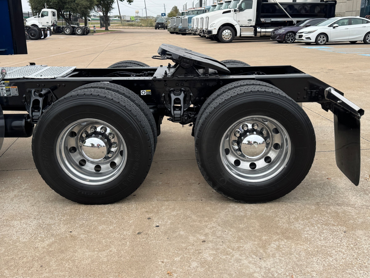 Kenworth T880 chassis with dual rear axles and wheels in view; no cab present in image.