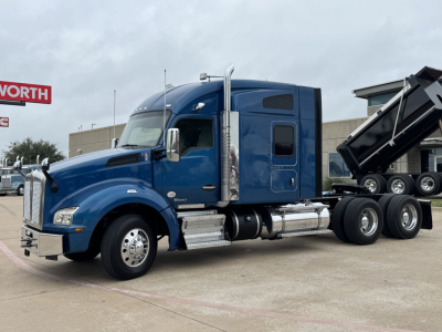 Blue Kenworth T880 sleeper cab tractor shown in side/front view with chrome fuel tanks and chrome exhaust stacks.