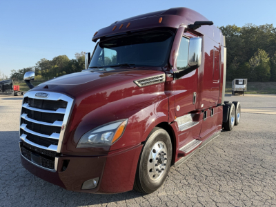 Freightliner Cascadia 126 sleeper truck in maroon, angled front-left view with chrome grille and dual rear axles.
