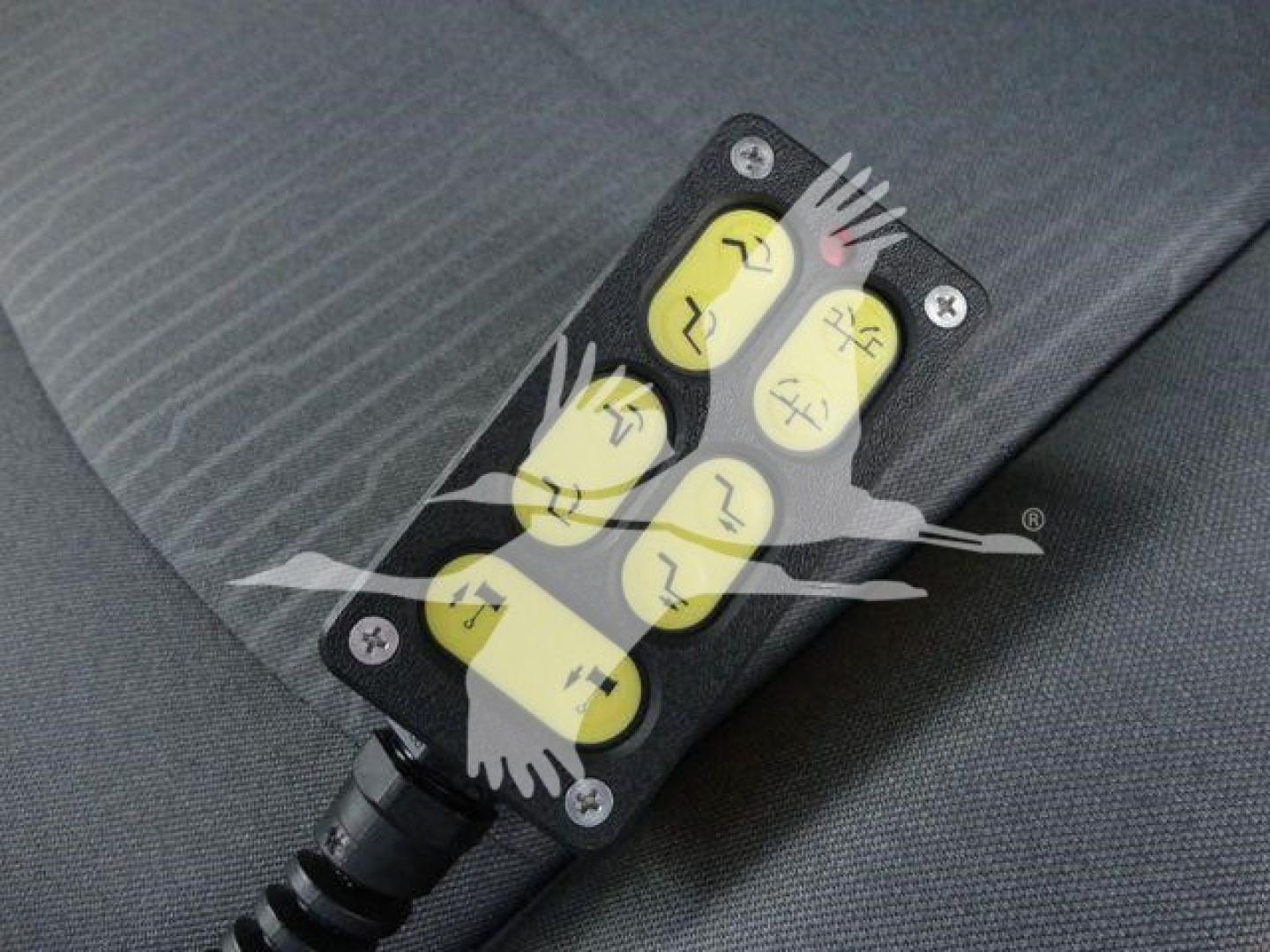 LED warning indicator panel with four yellow push buttons and black housing mounted on fabric surface.