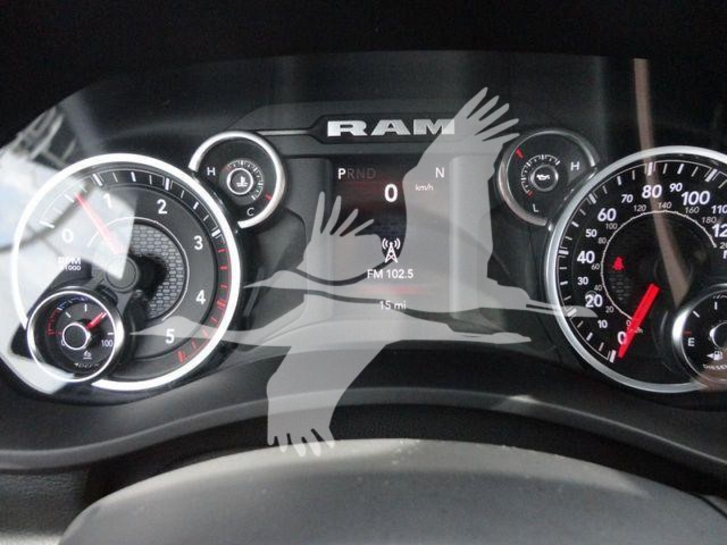 Ram instrument cluster and center display showing dashboard with dials and RAM branding.