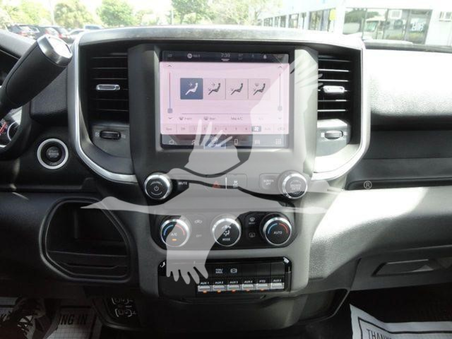 Ram 4500 truck interior showing a touchscreen infotainment system with climate controls and center console.
