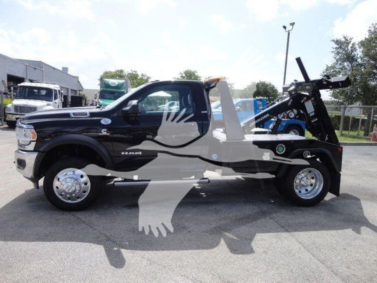 Ram 4500 SLT tow truck with winch mount in side profile showing stock number J33421FM and category Trucks.