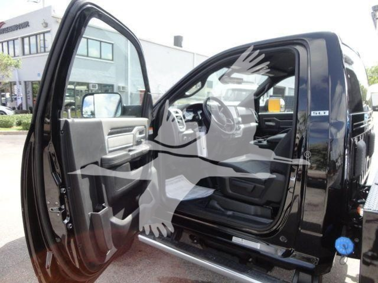Ram 4500 SLT pickup with front passenger door open showing interior and steering wheel.