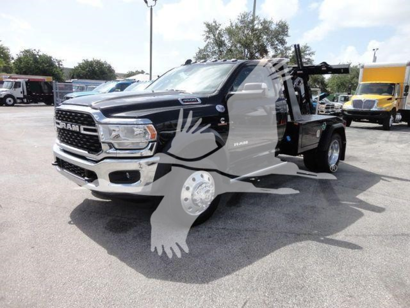 Ram 4500 SLT pickup truck winch equipment visible in truck bed, front grille and headlights clearly shown.