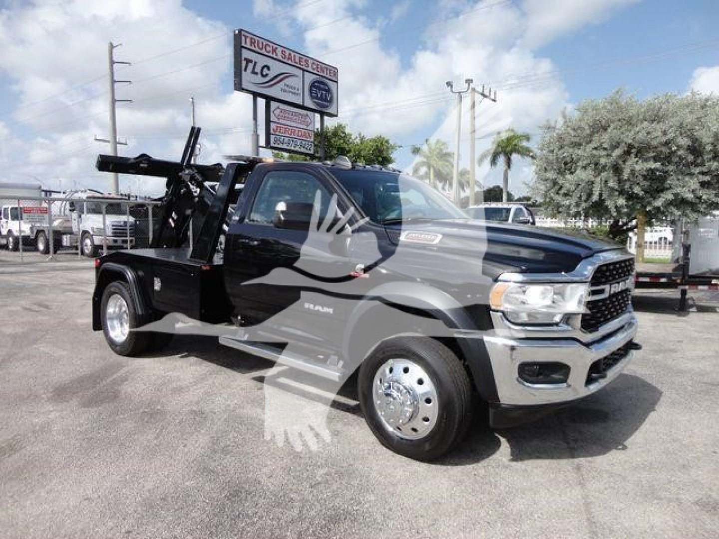 Ram 4500 SLT pickup truck with tow winch setup, side view showing front grille and wheel, stock number J33421FM.