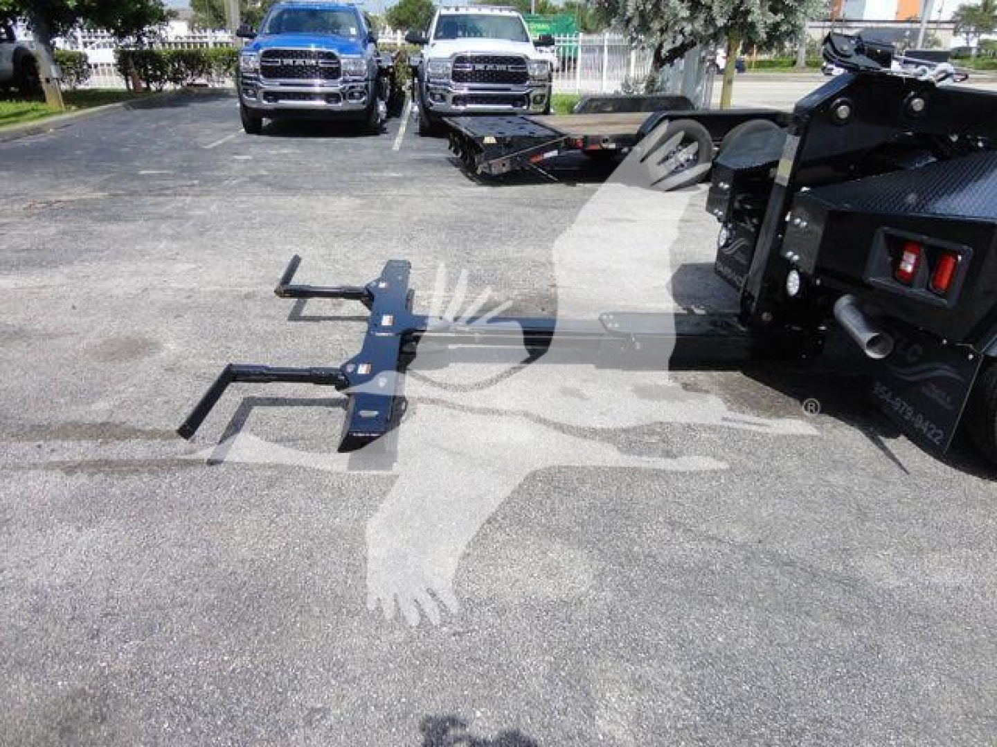 Truck winch assembly with mounting brackets and hitch receiver attached to tow equipment, with Ram 4500 chassis in background.