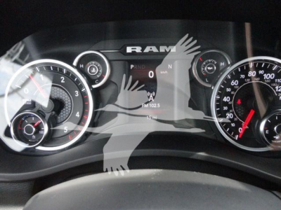 Ram instrument cluster and center display showing dashboard with dials and RAM branding.