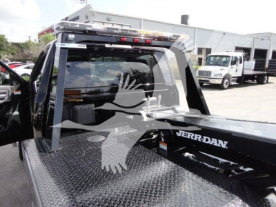 Ram 4500 pickup with a Jerr-Dan tow body; rear cab window; diamond plate bed; winch equipment visible; JERR-DAN branding on the bed; no visible license plates.