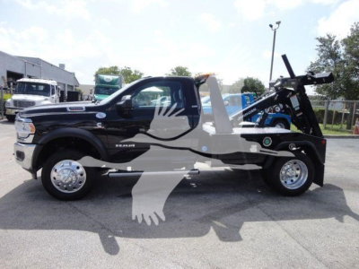 Ram 4500 SLT tow truck with winch mount in side profile showing stock number J33421FM and category Trucks.