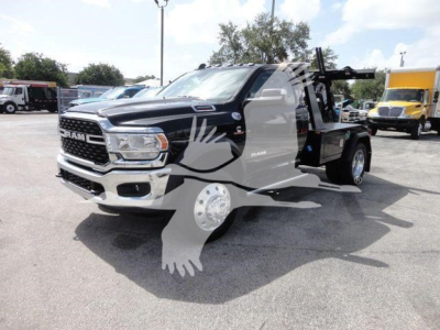 Ram 4500 SLT pickup truck winch equipment visible in truck bed, front grille and headlights clearly shown.