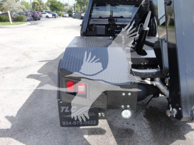 Ram 4500 SLT truck near winch area showing rear deck and access steps.