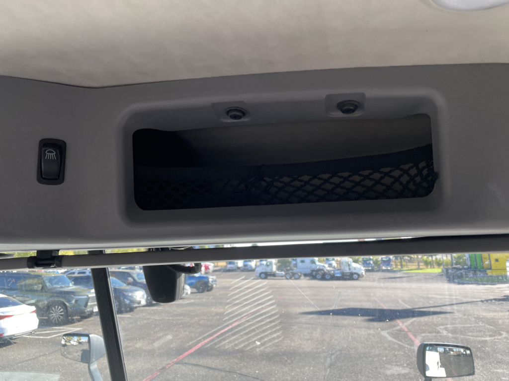 Trailerless image showing overhead storage pocket and interior ceiling of Mack AN64T truck cab with sun visor and visor mount.