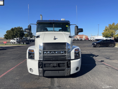 Truck front view of a white 2020 Mack AN64T conventional daycab showing grille with MACK emblem and bumper.