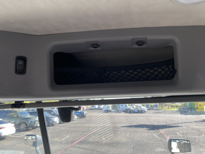 Trailerless image showing overhead storage pocket and interior ceiling of Mack AN64T truck cab with sun visor and visor mount.